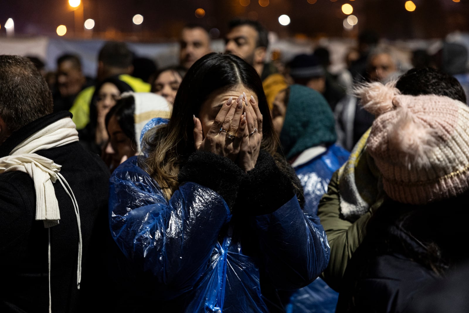 People gather to mark the two-year anniversary of the country's catastrophic earthquake, in Antakya, southern Turkey, early Thursday, Feb. 6, 2025. (Ugur Yildirim/Dia Photo via AP)