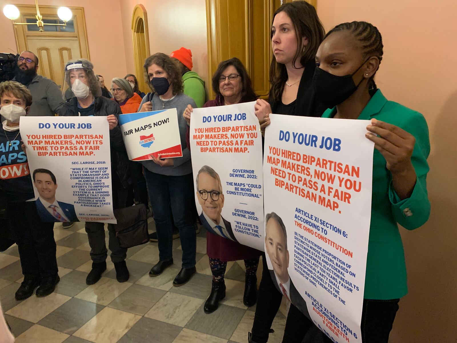 Demonstrators call on the Ohio Redistricting Commission to follow the guidance of the mapmakers they hired Monday night. JORDAN LAIRD / STAFF