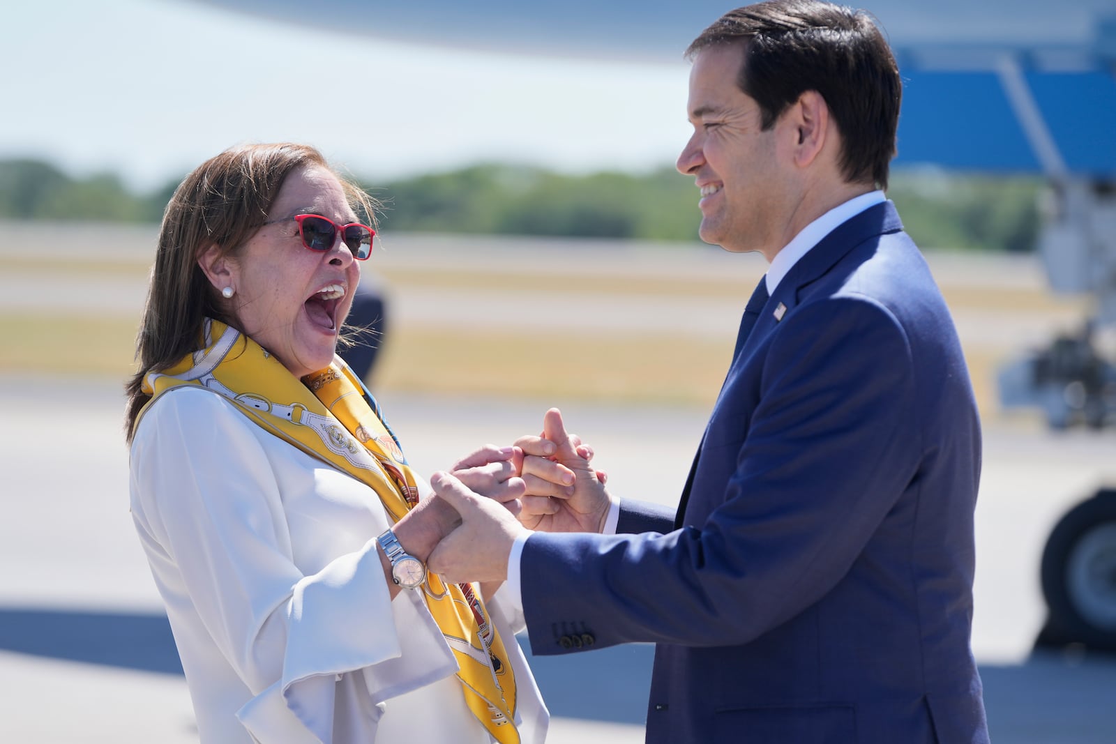 El Salvador's Foreign Minister Alexandra Hill Tinoco, left, welcomes U.S. Secretary of State Marco Rubio upon his arrival to the international airport in San Luis Talpa, El Salvador, Monday, Feb. 3, 2025. (AP Photo/Mark Schiefelbein, Pool)