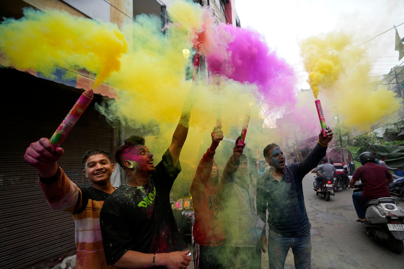 Indians play with colours as they celebrate Holi in Jammu, India, Friday, March 14, 2025. (AP Photo/Channi Anand)