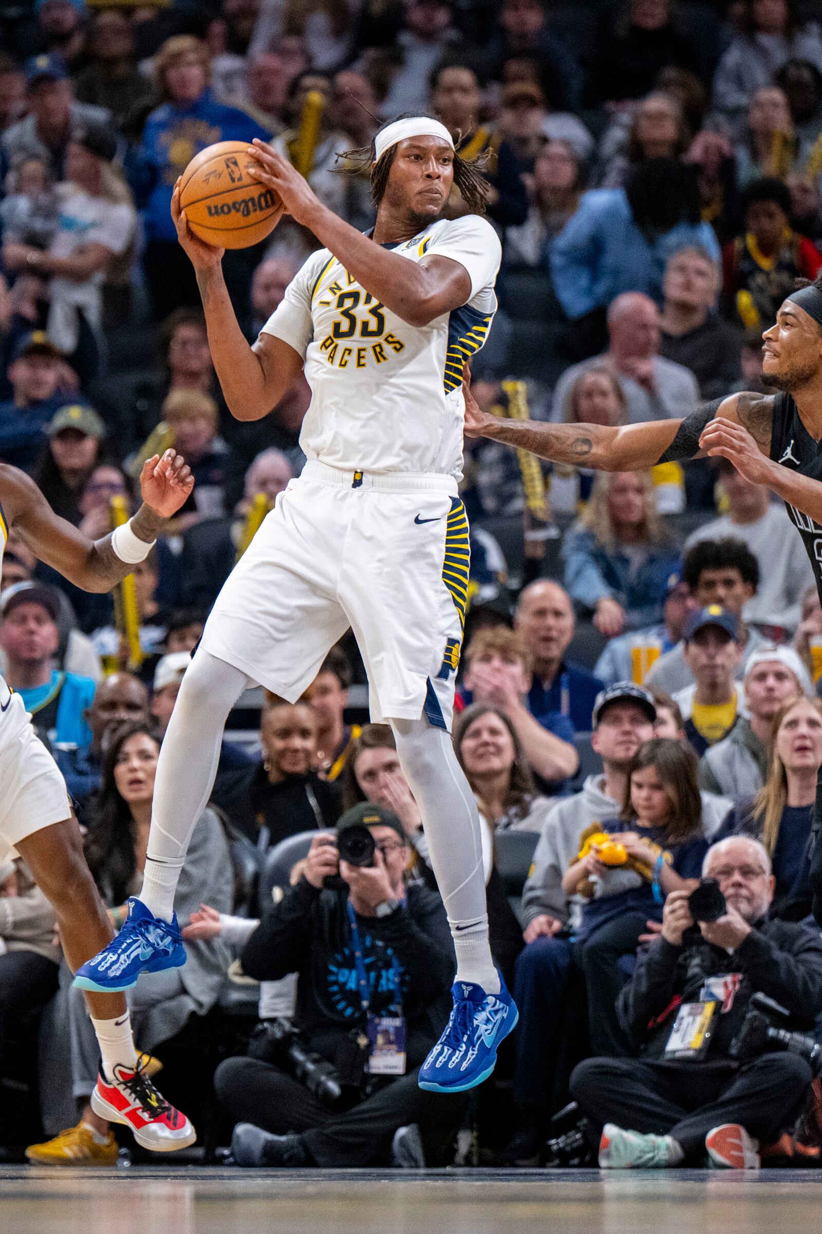 Indiana Pacers center Myles Turner (33) grabs a rebound during the second half of an NBA basketball game against the Brooklyn Nets in Indianapolis, Saturday, March 22, 2025. (AP Photo/Doug McSchooler)