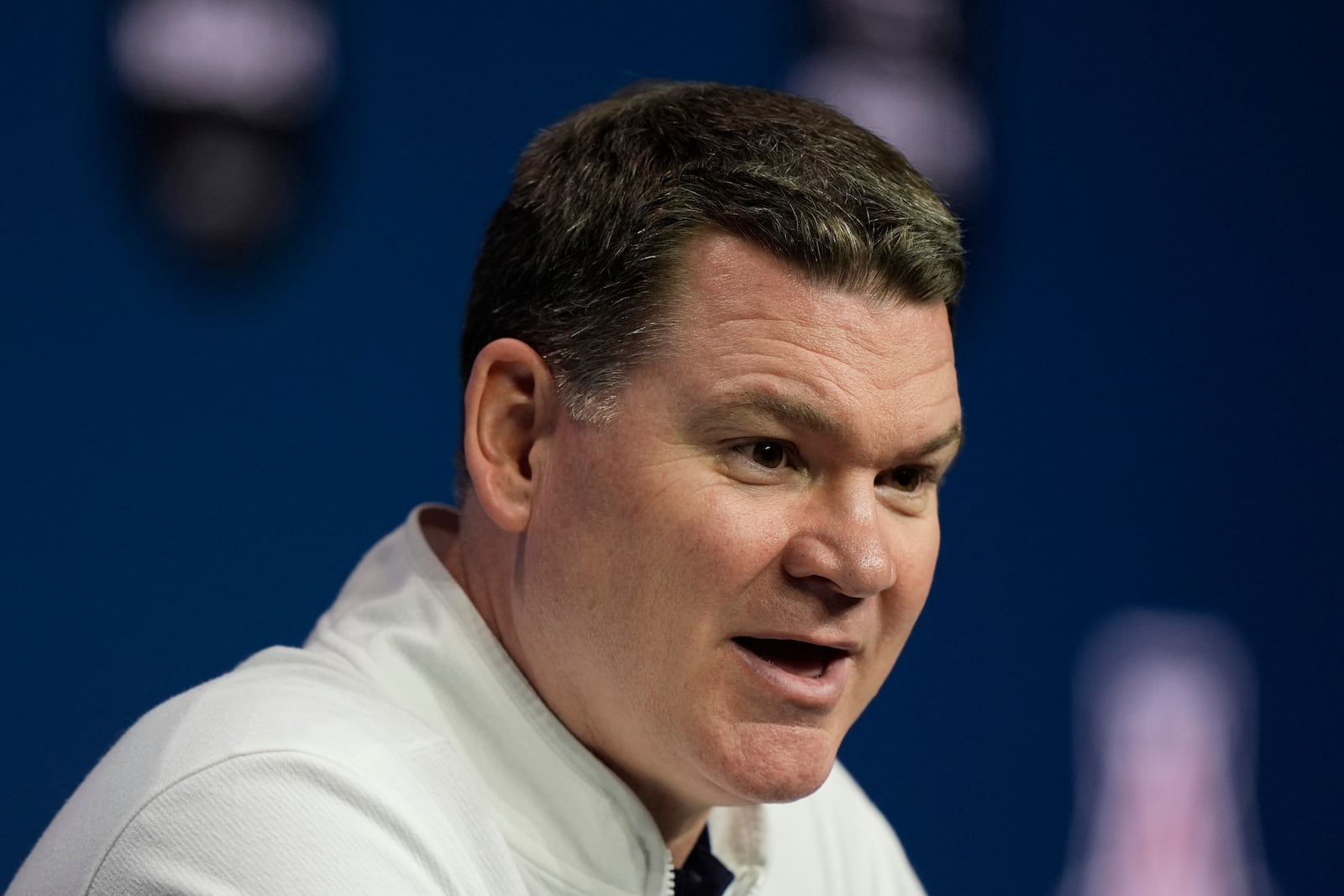 Arizona head coach Tommy Lloyd addresses the media during the NCAA college Big 12 men's basketball media day, Wednesday, Oct. 23, 2024, in Kansas City, Mo. (AP Photo/Charlie Riedel)