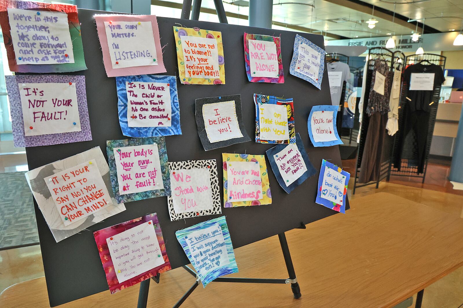 The "What Were You Wearing?" sexual assault exhibit on display in the Sara T. Landess Technology and Learning Center at Clark State Friday. BILL LACKEY/STAFF