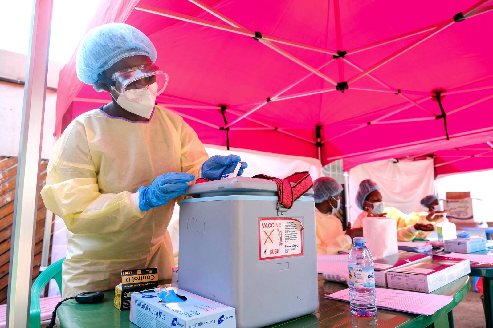 A health worker prepares to administer a a vaccine against the Sudan strain of Ebola, during a trial, at Mulago Referral Hospital, in Kampala, Uganda Monday, Feb. 3, 2025. (AP Photo/Hajarah Nalwadda)