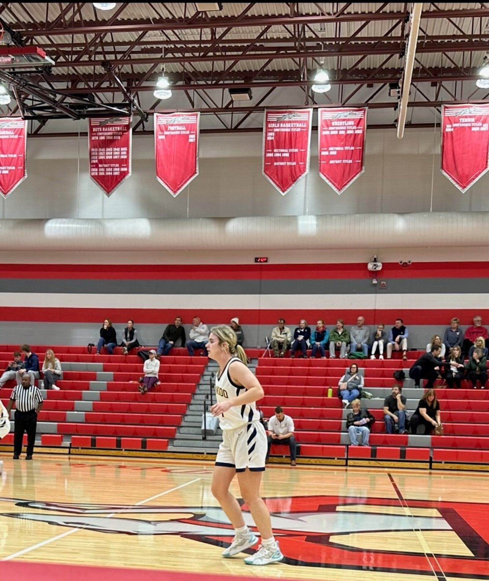 Emma Neff , who plays basketball and soccer with cochlear implants, in an Oakwood basketball game at Dixie, where she scored 21 points. CONTRIBUTED