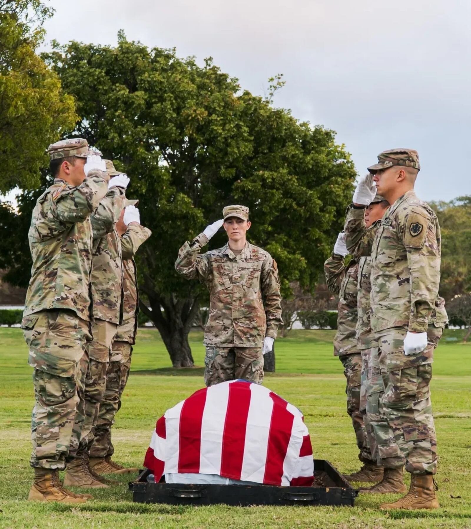 U.S. service members with the Defense POW/MIA Accounting Agency (DPAA) honor the fallen during a disinterment ceremony Feb. 7, 2022, at the National Memorial Cemetery of the Pacific in Honolulu, Hawaii. The remains disinterred will be transferred to the DPAA laboratory for possible identification. DPAA's mission is to achieve the fullest possible accounting for missing and unaccounted-for U.S. personnel to their families and our nation (U.S. Army photo by Sgt. Edward Randolph)