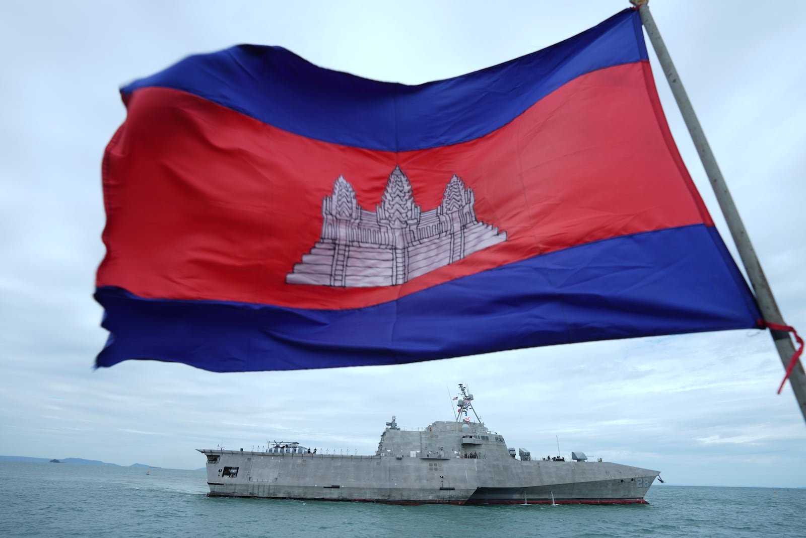 A Cambodian flag flutters as USS Savannah arrives for a port call at Sihanoukville port, Cambodia, Monday, Dec. 16, 2024. (AP Photo/Heng Sinith)