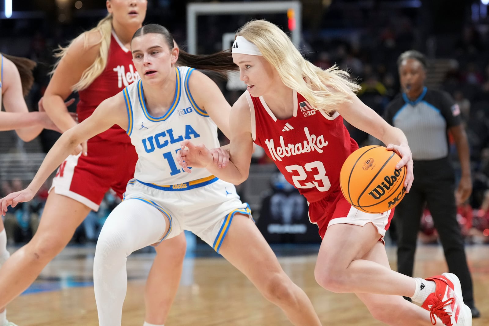 Nebraska guard Britt Prince (23) drives on UCLA guard Gabriela Jaquez (11) during the first half of an NCAA college basketball game in the quarterfinals of the Big Ten Conference tournament in Indianapolis, Friday, March 7, 2025. (AP Photo/AJ Mast)