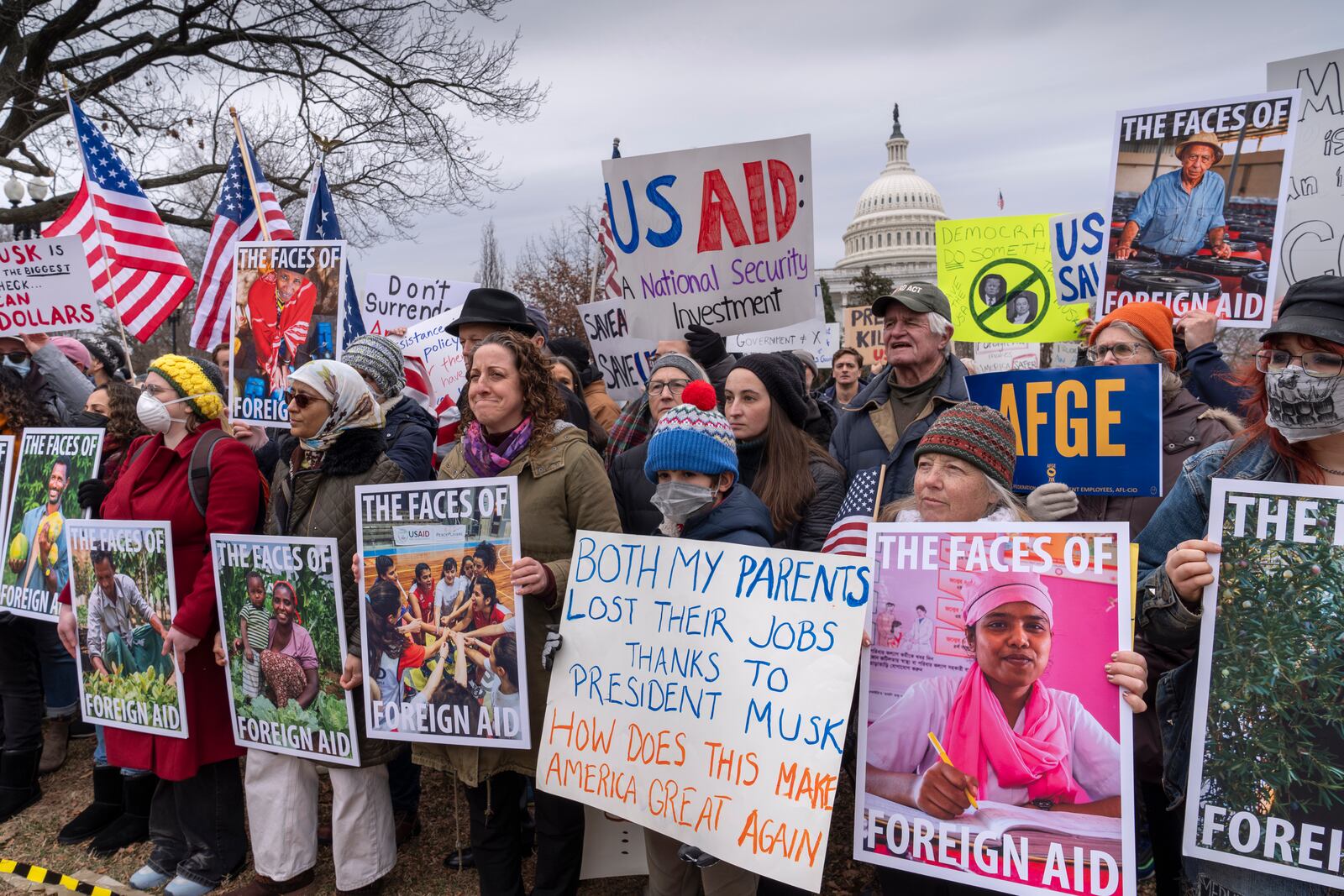 Demonstrators and lawmakers rally against President Donald Trump and his ally Elon Musk as they disrupt the federal government, including dismantling the U.S. Agency for International Development, which administers foreign aid approved by Congress, on Capitol Hill in Washington, Wednesday, Feb. 5, 2025. (AP Photo/J. Scott Applewhite)