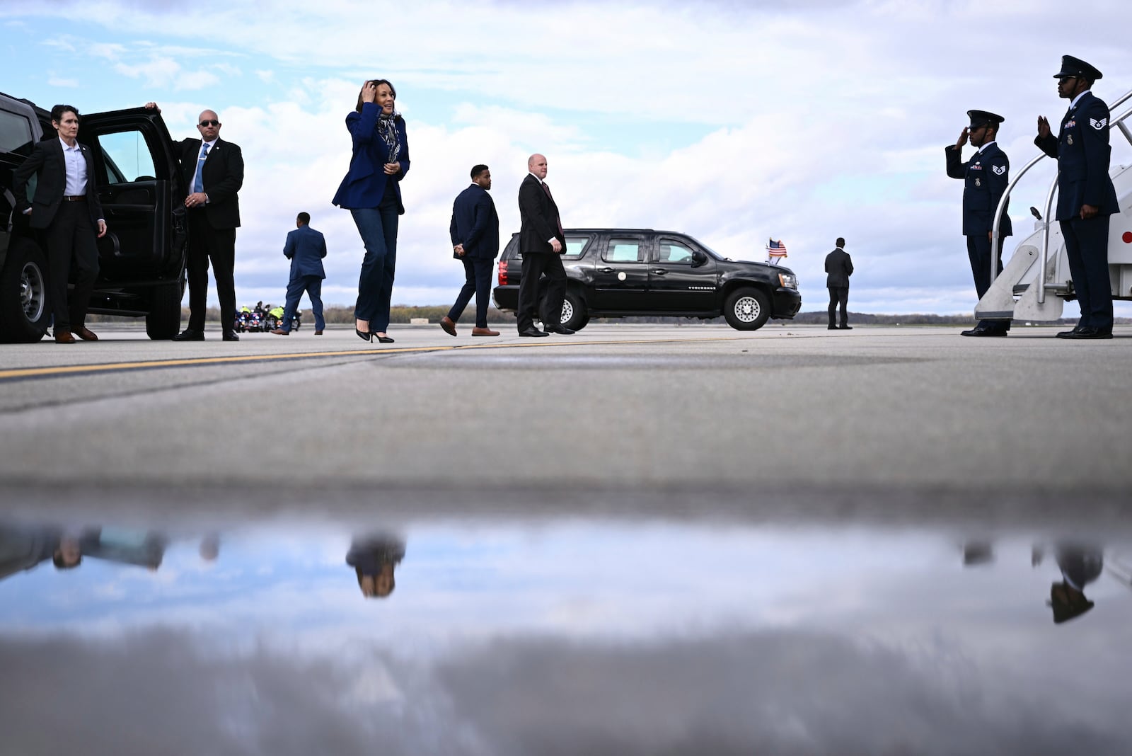 Democratic presidential nominee Vice President Kamala Harris walks to board Air Force Two before departing Dane County Regional Airport in Madison, Wis., Thursday, Oct. 31, 2024. (Brendan Smialowski/ Pool via AP)