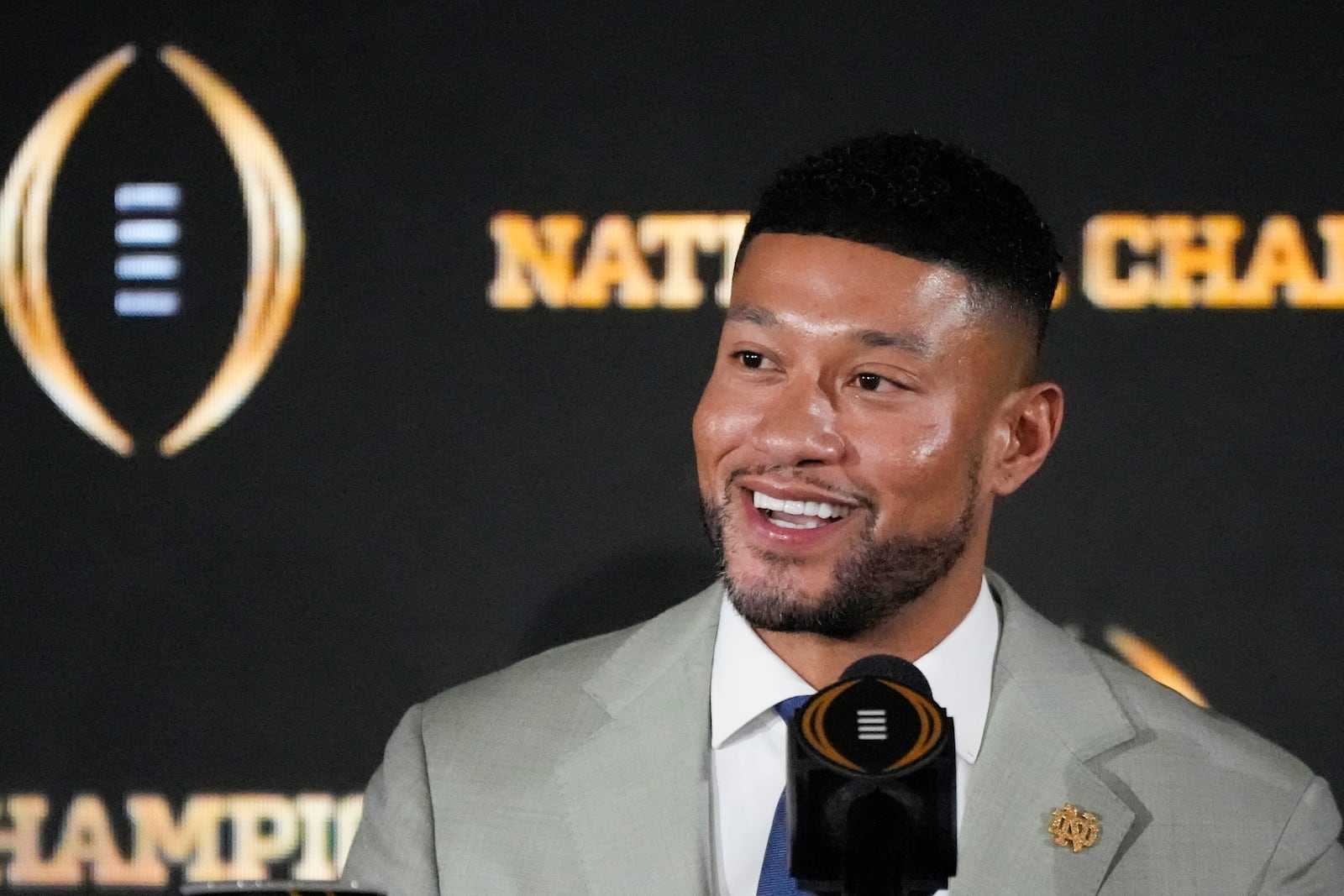 Notre Dame head coach Marcus Freeman speaks during a news conference ahead of the College Football Playoff national championship game Sunday, Jan. 19, 2025, in Atlanta. The game between Ohio State and Notre Dame will be played on Monday. (AP Photo/Chris Carlson)