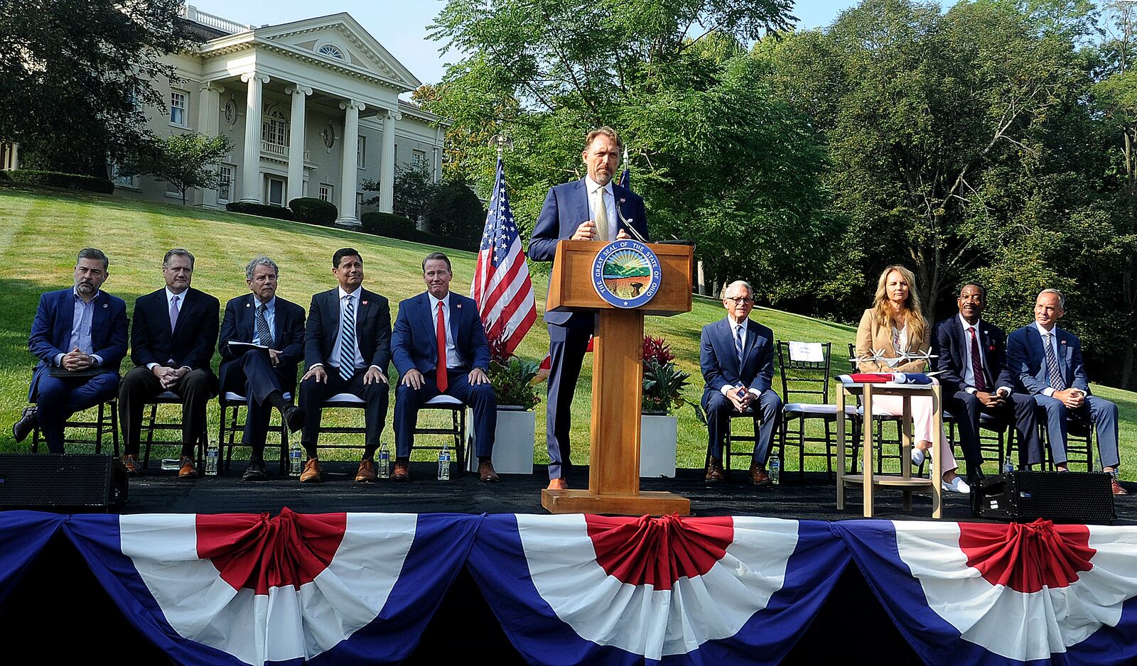 Joby Aviation Inc. founder JoeBen Bevirt announces Monday, Sept. 18, 2023, his company's pledge to bring thousands of jobs to the region at through a facility near Dayton International Airport that specializes in the production of "flying cars." In the background is Hawthorn Hill, the home of Orville Wright in Oakwood. MARSHALL GORBY\STAFF