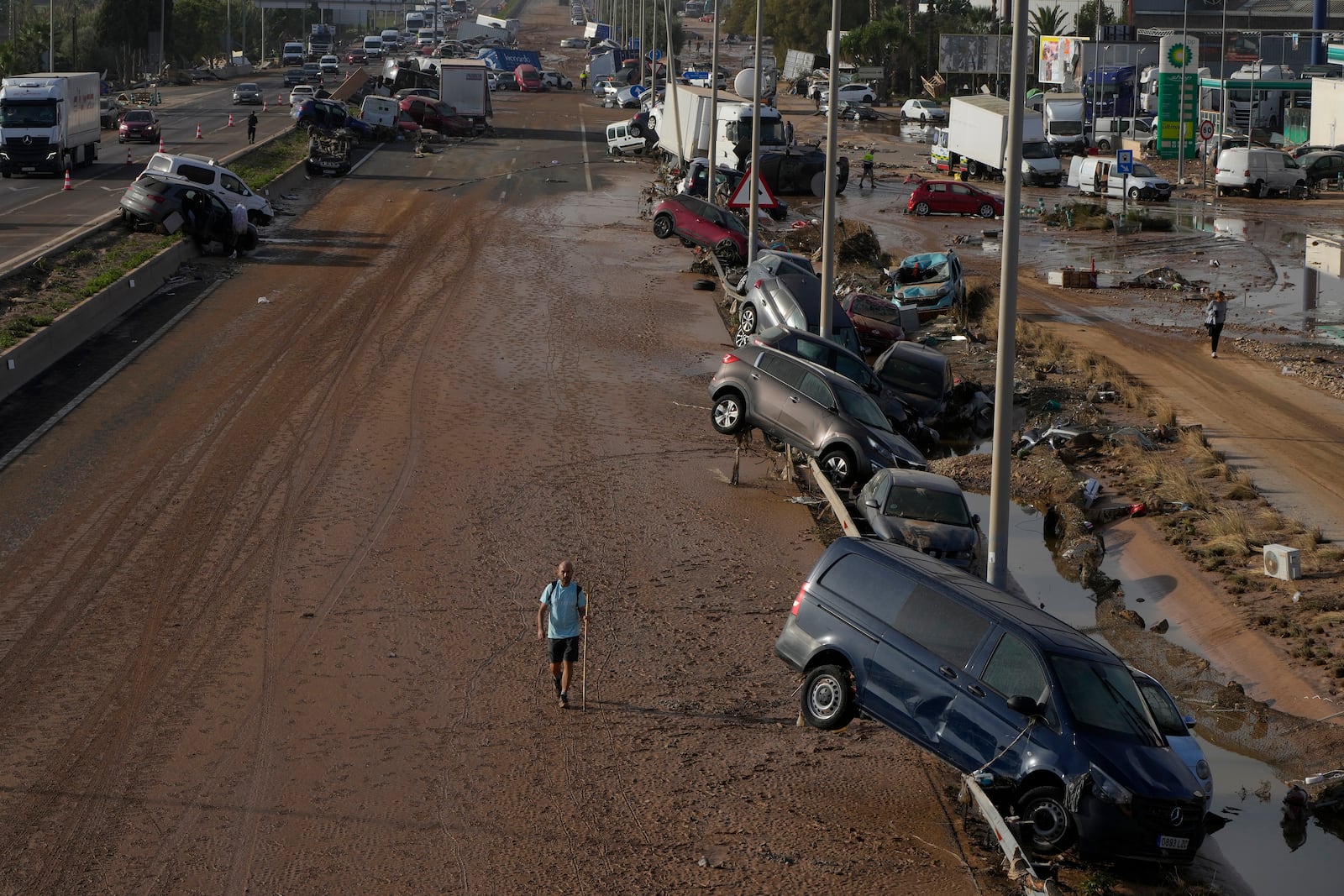 Vehicles are seen piled up after being swept away by floods on a motorway in Valencia, Spain, Thursday, Oct. 31, 2024. (AP Photo/Manu Fernandez)