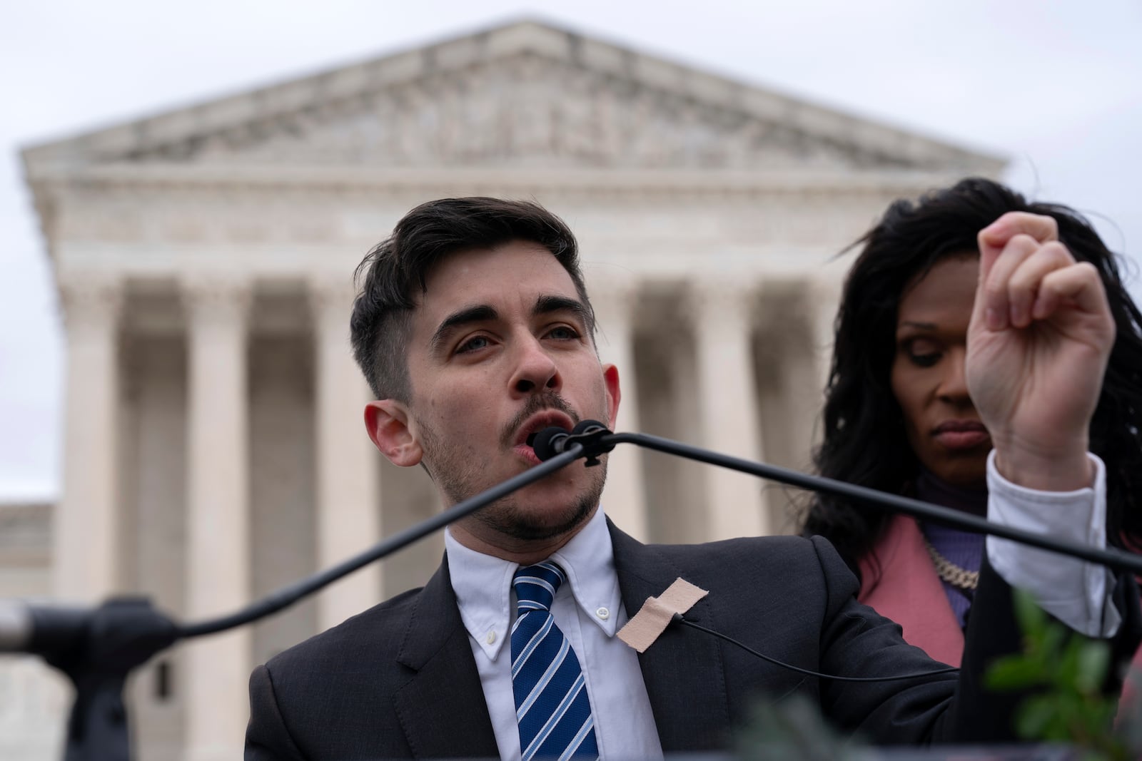 Attorney and transgender rights activist Chase Strangio speaks to supporters outside of the Supreme Court, Wednesday, Dec. 4, 2024, in Washington. (AP Photo/Jose Luis Magana)