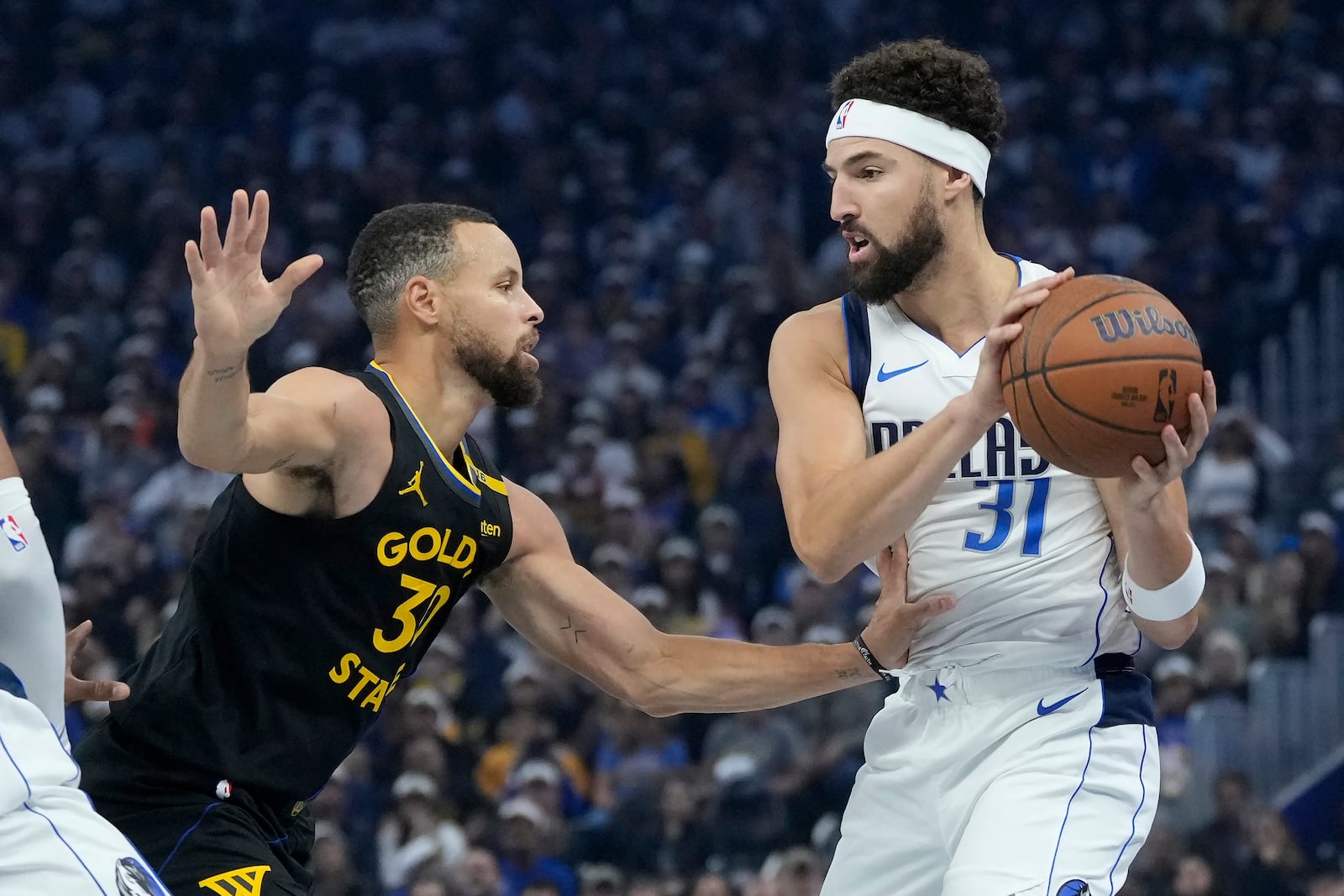 Dallas Mavericks guard Klay Thompson, right, is defended by Golden State Warriors guard Stephen Curry (30) during the first half of an Emirates NBA Cup basketball game in San Francisco, Tuesday, Nov. 12, 2024. (AP Photo/Jeff Chiu)