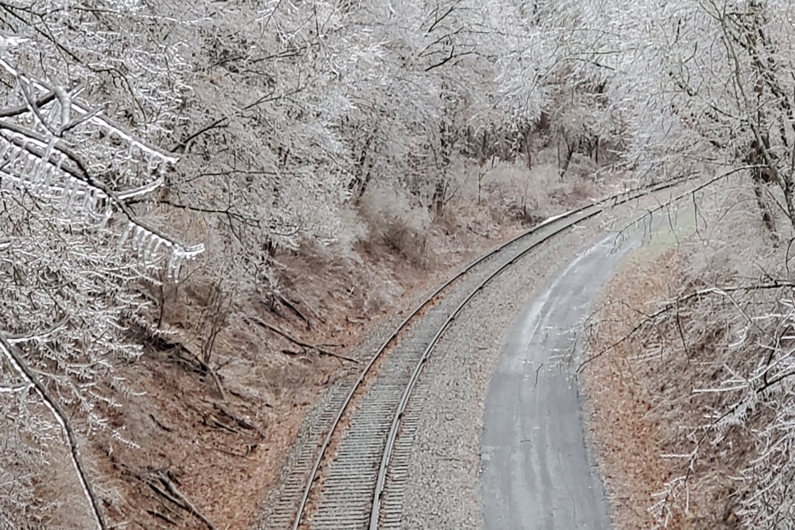 Trees covered in ice line the Great Allegheny Passage near Frostburg, Md., on Thursday, Feb. 6 2025. (Ken Nolan/Cumberland Times-News via AP)