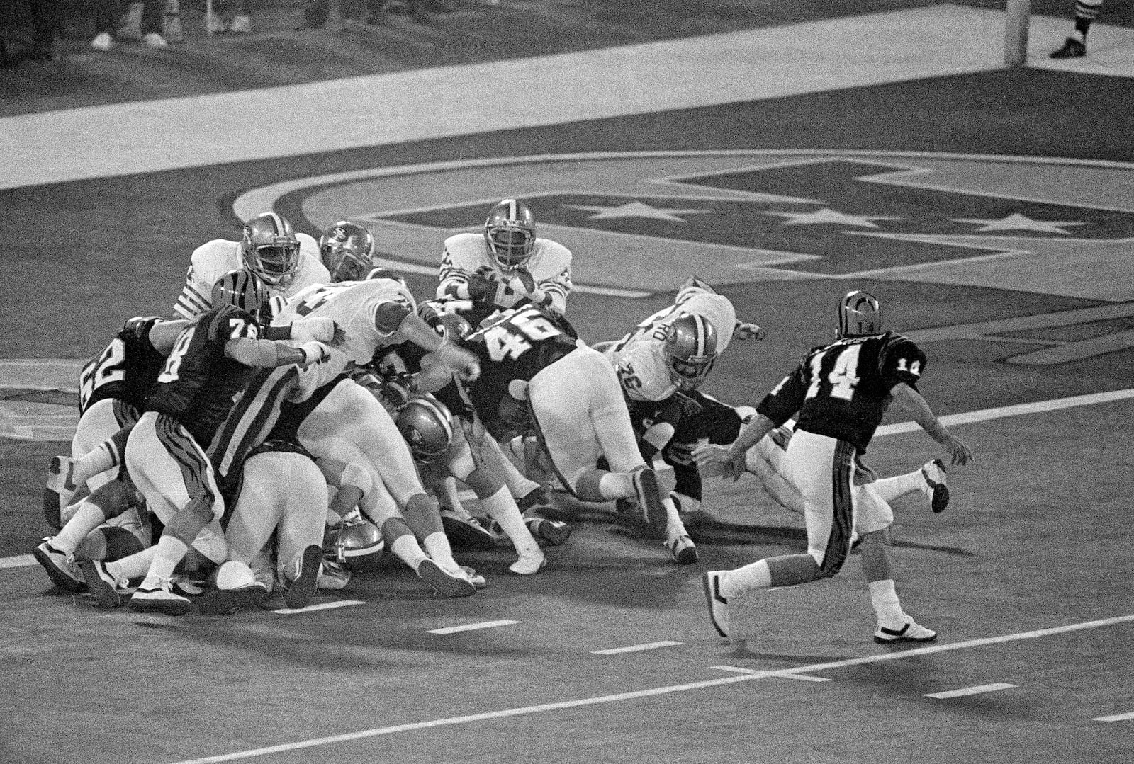 Bengals running back Pete Johnson (46) is stopped short of the goal line after taking a handoff from quarterback Ken Anderson (14). The Bengals lost Super Bowl XVI to the San Francisco 49ers, 26-21 in January 1982. FILE PHOTO