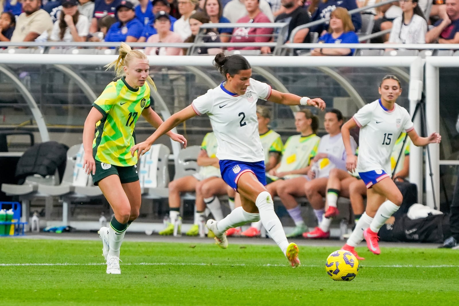 United States defender Emily Sams (2) dribbles past Australia forward Holly McNamara (17) during the first half of a group stage match in the SheBelieves Cup women's soccer tournament, Sunday, Feb. 23, 2025, in Glendale, Ariz. (AP Photo/Samantha Chow)