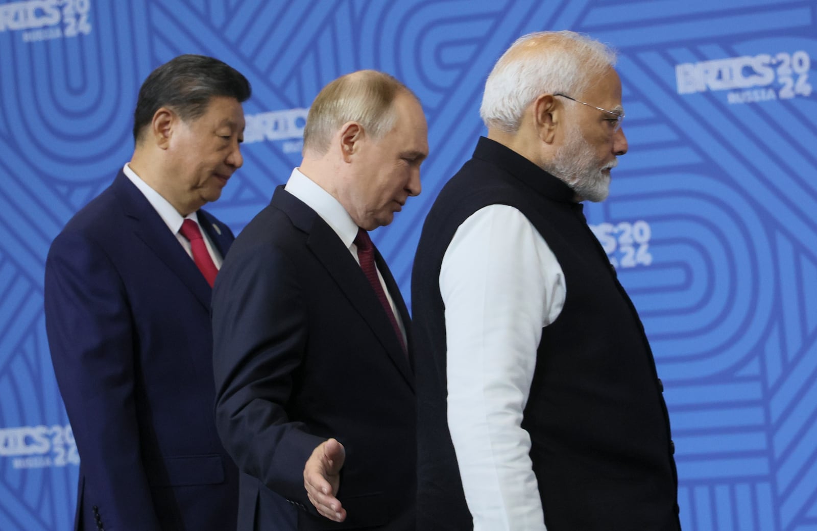 From left: Chinese President Xi Jinping, Russian President Vladimir Putin and Indian Prime Minister Narendra Modi attend a family photo ceremony prior to the BRICS Summit plenary session in Kazan, Russia, Wednesday, Oct. 23, 2024. (Maxim Shipenkov, Pool Photo via AP)