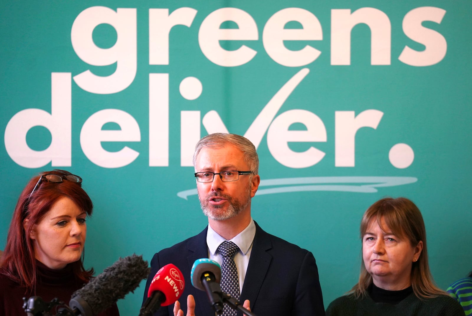 Green leader Roderic O'Gorman, center, speaks to the media during a press conference at the Irish Architectural Archive, on the last day of campaigning on the eve of the General Election, in Dublin, Thursday, Nov. 28, 2024. (Brian Lawless/PA via AP)