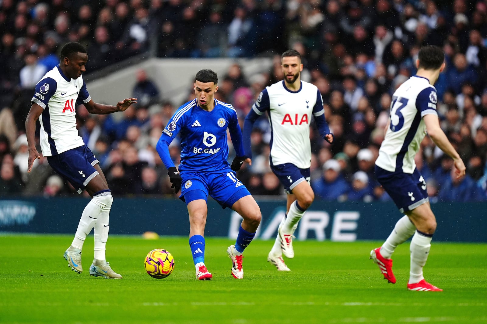 Leicester City's Bilal El Khannouss, second left, vies for the ball with Tottenham Hotspur players, during the English Premier League soccer match between Tottenham Hotspur and Leicester City, at Tottenham Hotspur Stadium, London, Sunday, Jan. 26, 2025. (Mike Egerton/PA via AP)