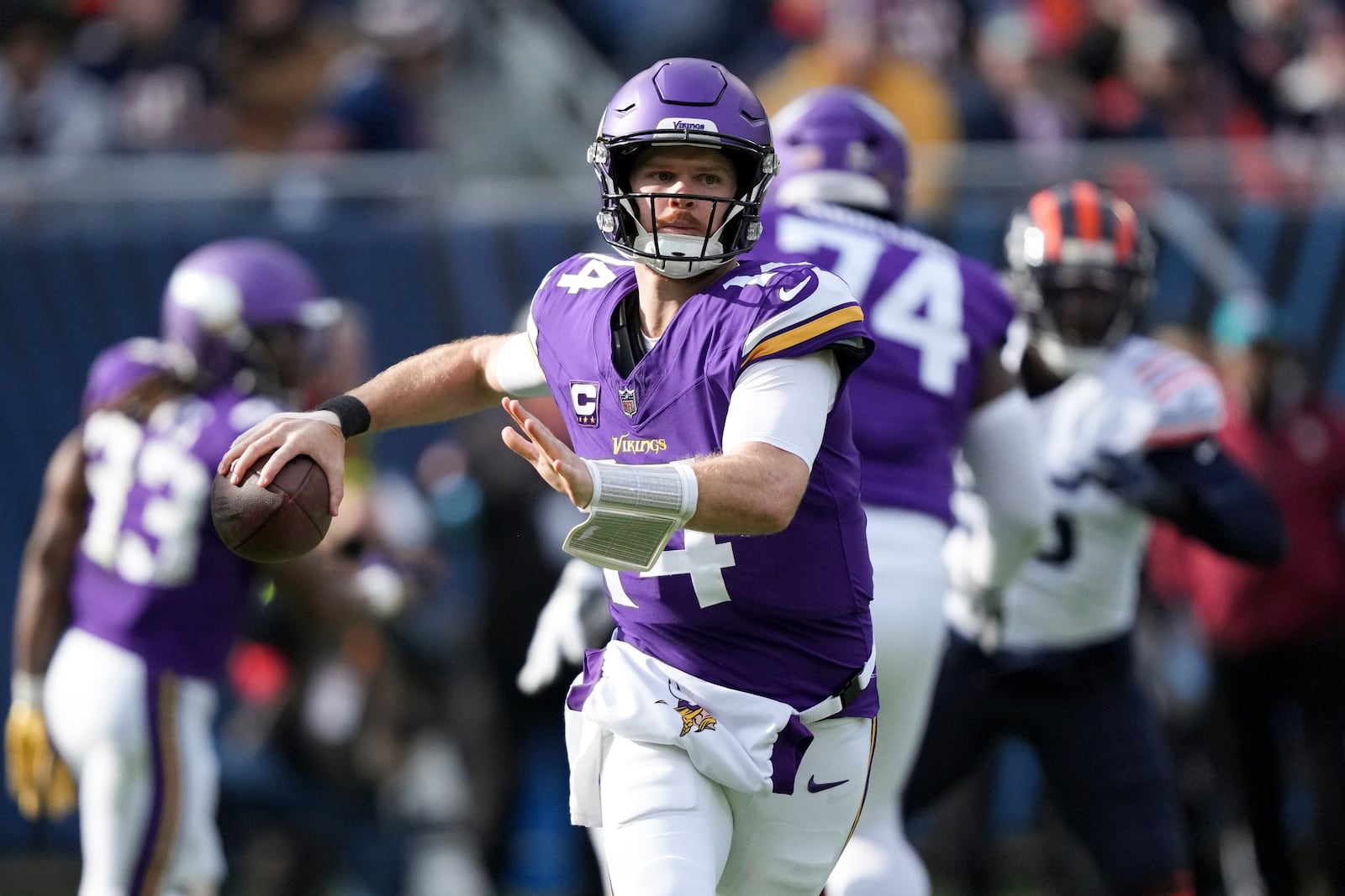 Minnesota Vikings quarterback Sam Darnold (14) throws a pass during the first half of an NFL football game against the Chicago Bears, Sunday, Nov. 24, 2024, in Chicago. (AP Photo/Charles Rex Arbogast)