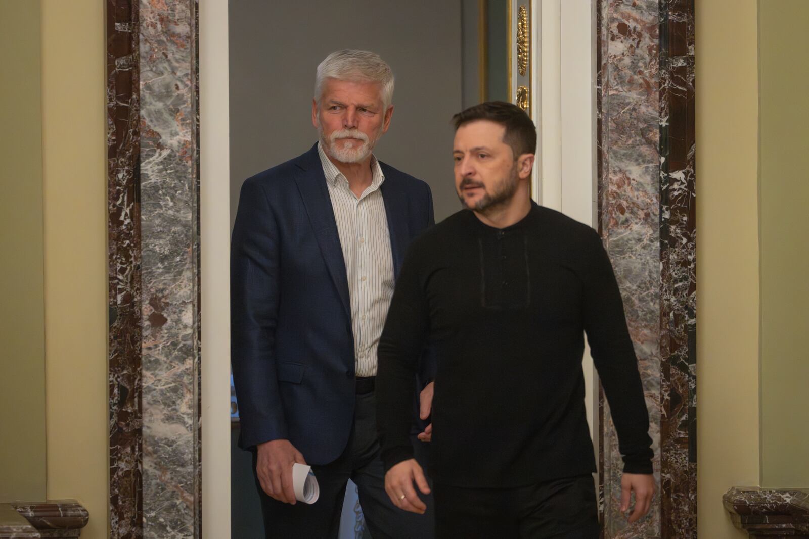 Ukrainian President Volodymyr Zelenskyy, right, and Czech Rebublic's President Petr Pavel arrive for a joint press conference in Kyiv, Ukraine, Friday, March 21, 2025. (AP Photo/Efrem Lukatsky).