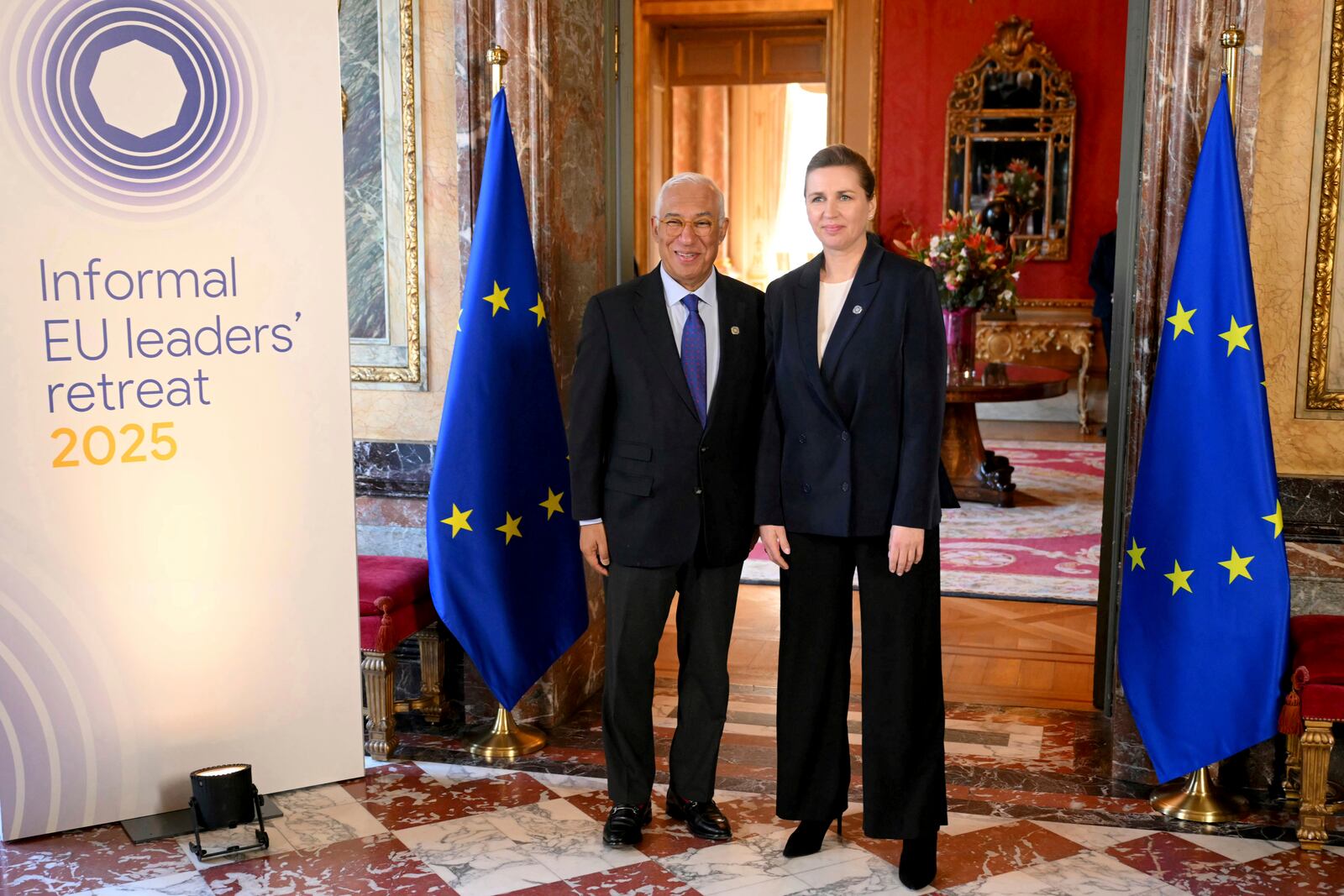 European Council President Antonio Costa, left, greets Denmark's Prime Minister Mette Frederiksen as she arrives for an EU summit at the Egmont Palace in Brussels, Monday, Feb. 3, 2025. (Nicolas Tucat, Pool Photo via AP)