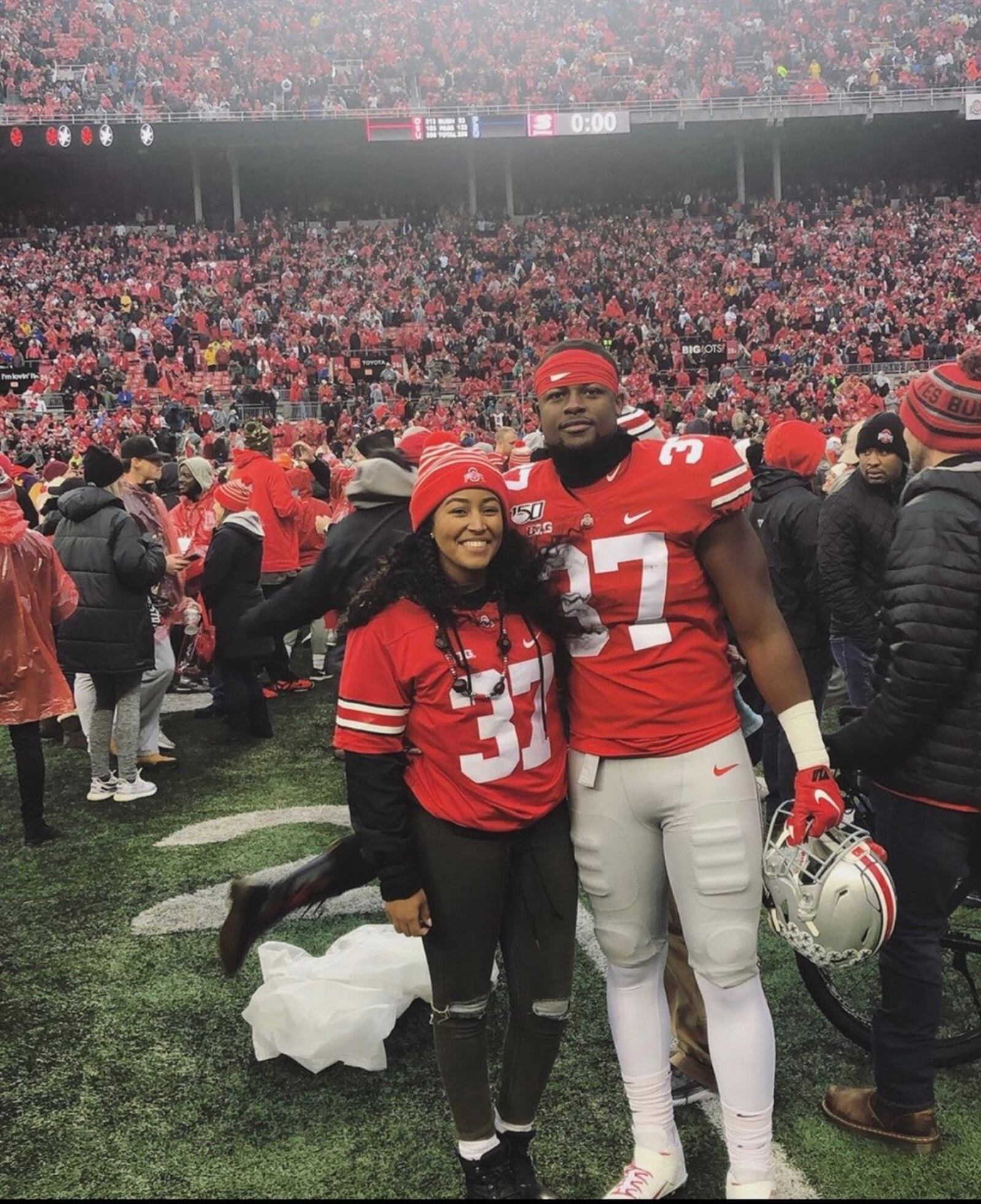 Ohio State’s Derrick Malone and his girlfriend, Michaela Roper, on the field at Ohio Stadium after the Buckeyes’ win over Penn State. CONTRIBUTED