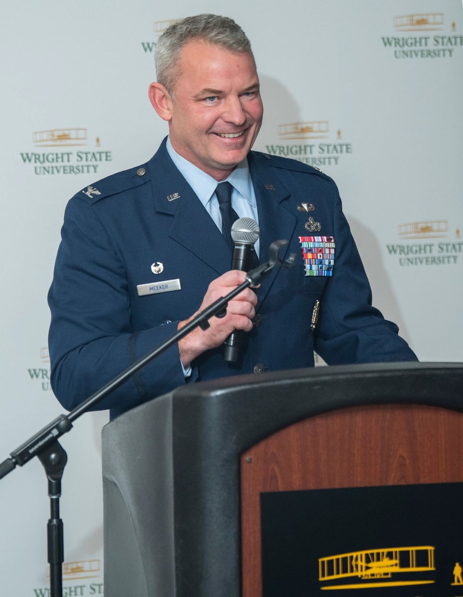 In an Air Force photo from December 2022, Col. Christopher Meeker, commander of the 88th Air Base Wing and Wright-Patterson Air Force Base, at a ceremonial signing of a collaborative agreement between Wright State University and the base.