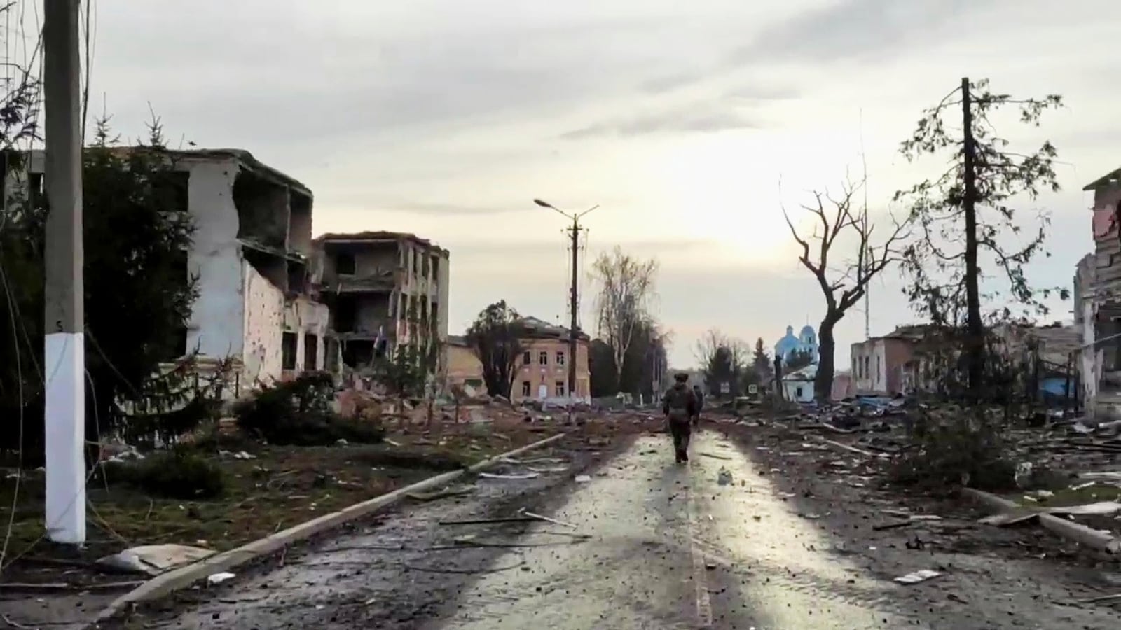 In this photo taken from video distributed by Russian Defense Ministry Press Service on Thursday, March 13, 2025, a Russian soldier patrols an area in Sudzha, the Kursk region of Russia after it was taken over by Russian troops. (Russian Defense Ministry Press Service via AP)