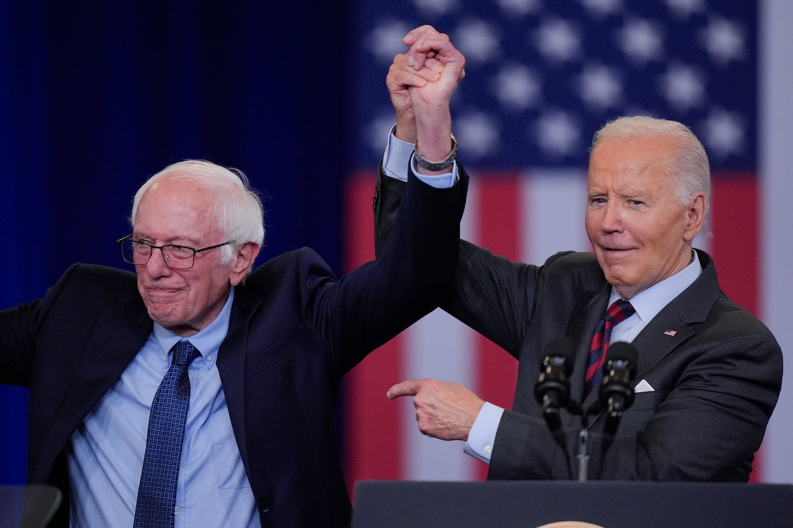 President Joe Biden with Sen. Bernie, D-Vt., after Biden delivered remarks on lowering the cost of prescription drugs, at NHTI Concord Community College, Tuesday, Oct. 22, 2024, in Concord, N.H.. (AP Photo/Steven Senne)