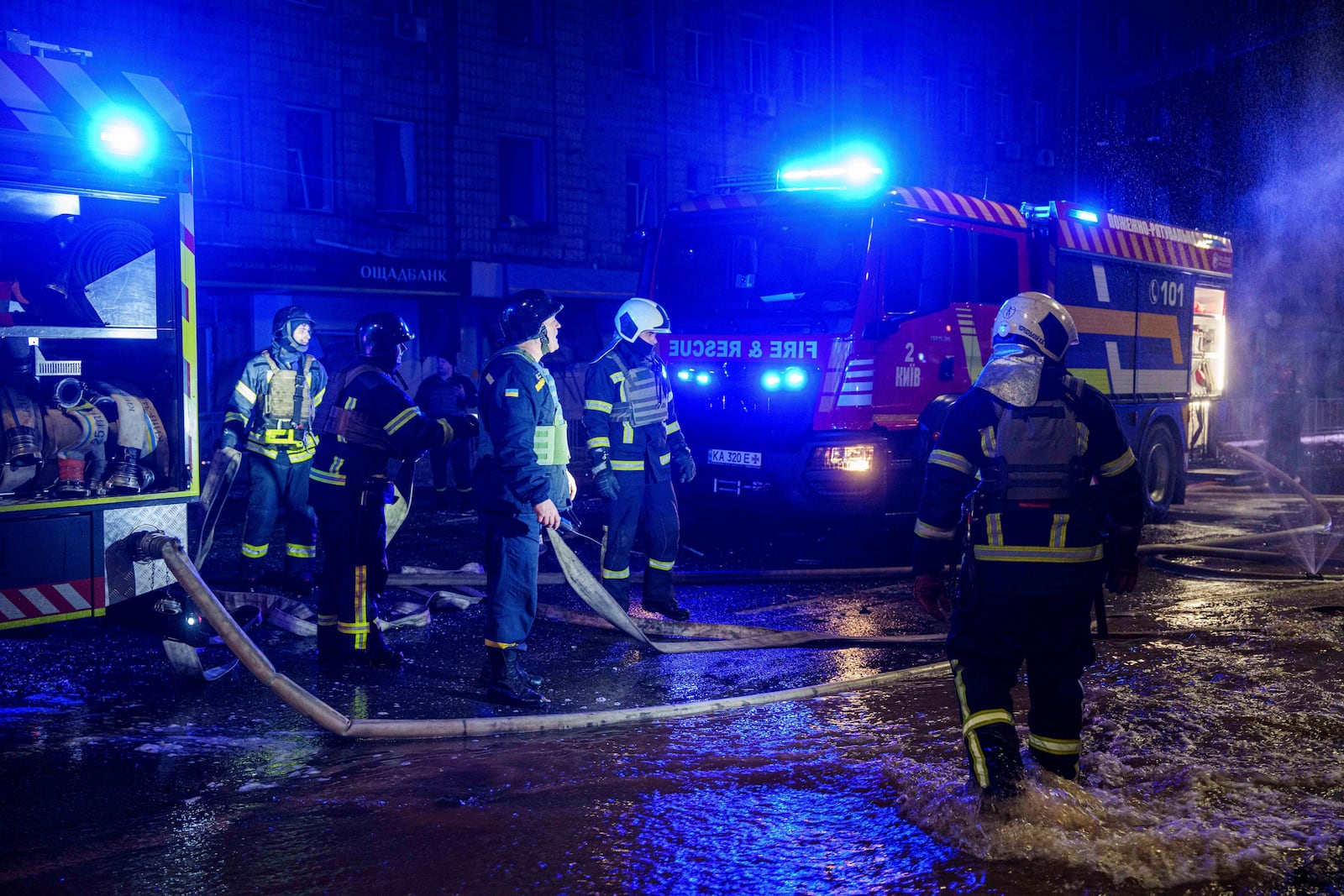 Rescuers work the site of a Russian missile strike on Kyiv, Ukraine, Saturday, Jan. 18, 2024. (AP Photo/Evgeniy Maloletka)