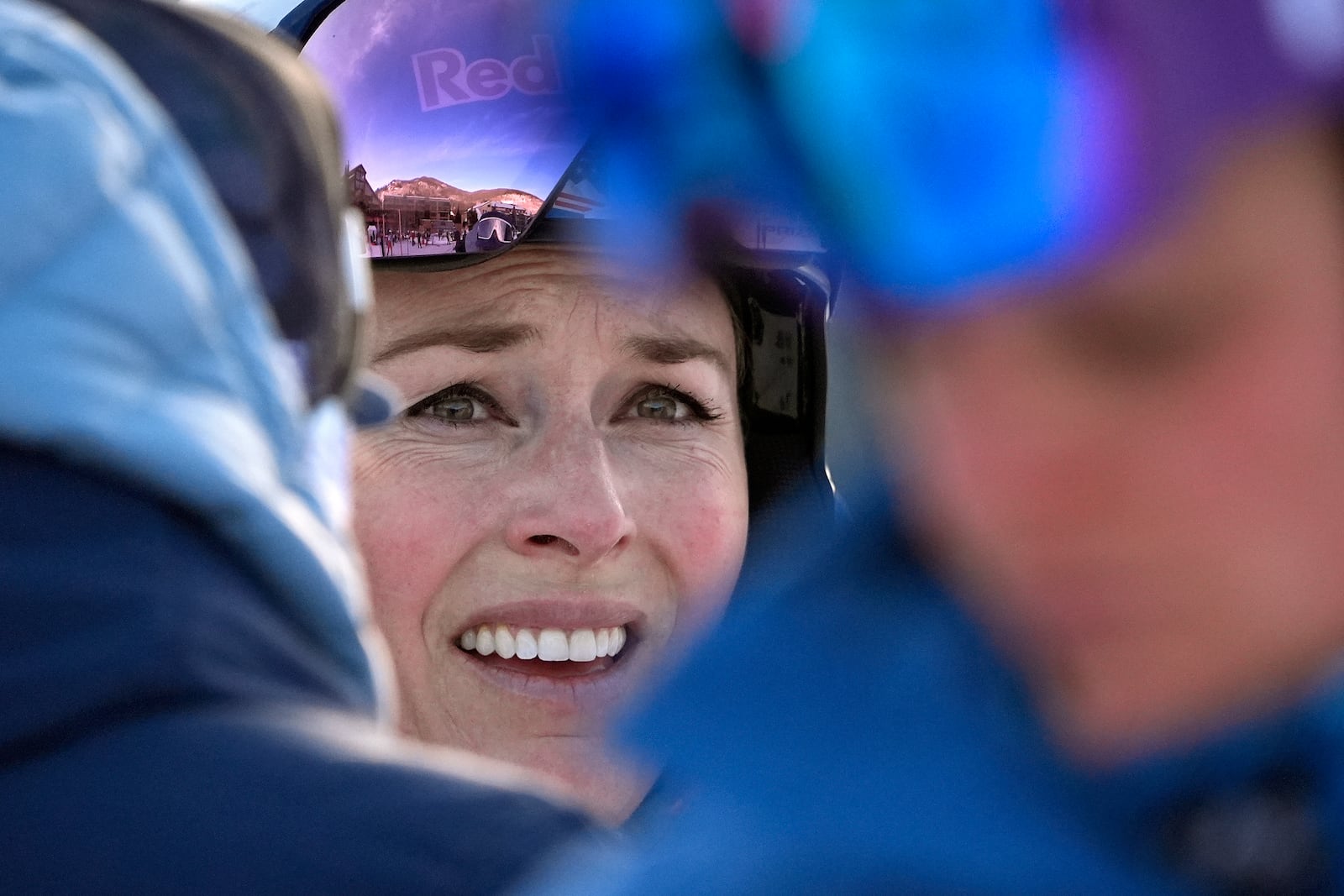 Lindsey Vonn talks with a coach after competing in a Super G skiing race at Copper Mountain Ski Resort, Sunday, Dec. 8, 2024, in Copper Mountain, Colo. (AP Photo/Robert F. Bukaty)