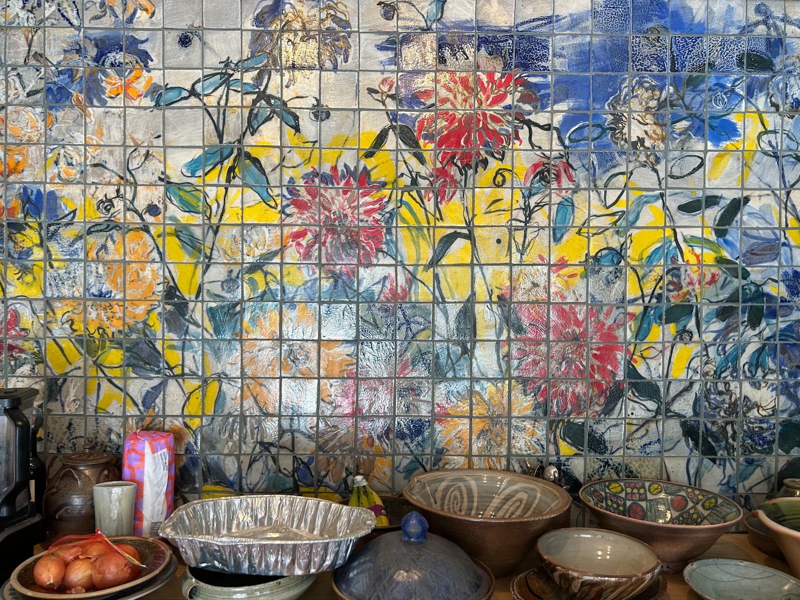 A handpainted tile mural in Naysan Mcllhargey's kitchen was a collaboration with local artist Jennifer Rosengarten.