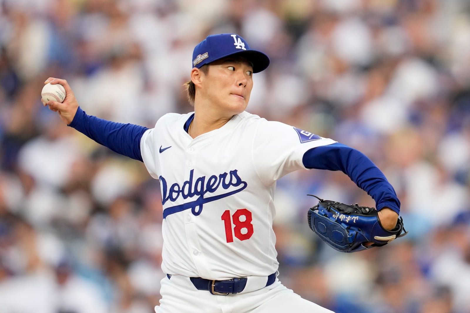 Los Angeles Dodgers starting pitcher Yoshinobu Yamamoto throws to a San Diego Padres batter during the second inning in Game 5 of a baseball NL Division Series Friday, Oct. 11, 2024, in Los Angeles. (AP Photo/Ashley Landis)