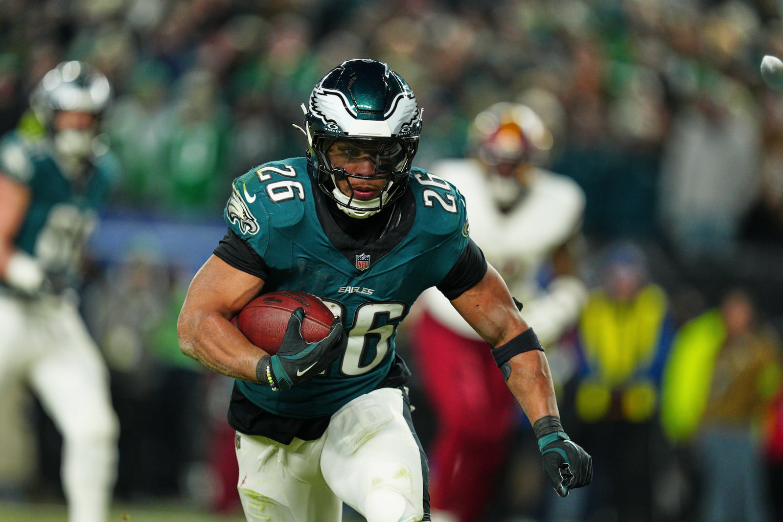 Philadelphia Eagles running back Saquon Barkley (26) rushes for a touchdown against the Washington Commanders during the second half of the NFC Championship NFL football game, Sunday, Jan. 26, 2025, in Philadelphia. (AP Photo/Derik Hamilton)