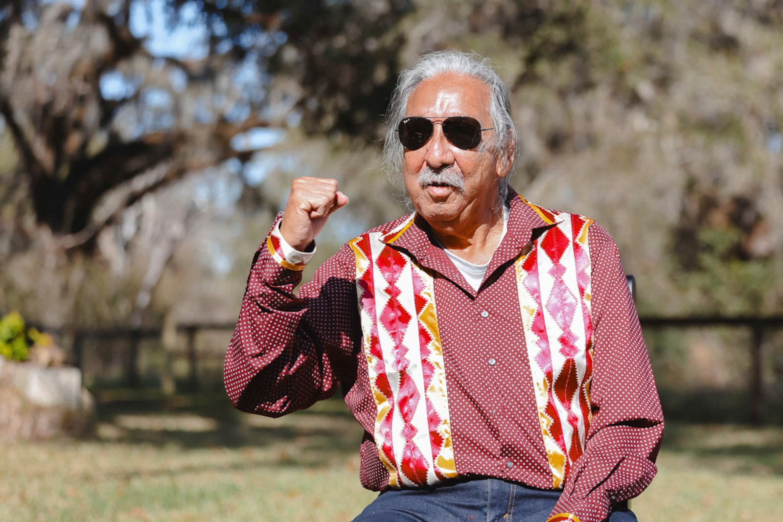 In this photo released by NDN Collective, Native American activist Leonard Peltier poses for pictures as he was released from a Florida prison on Tuesday, Feb. 18, 2025, weeks after then-President Joe Biden angered law enforcement officials by commuting his life sentence to home confinement in the 1975 killings of two FBI agents. (Angel White Eyes, NDN Collective via AP)