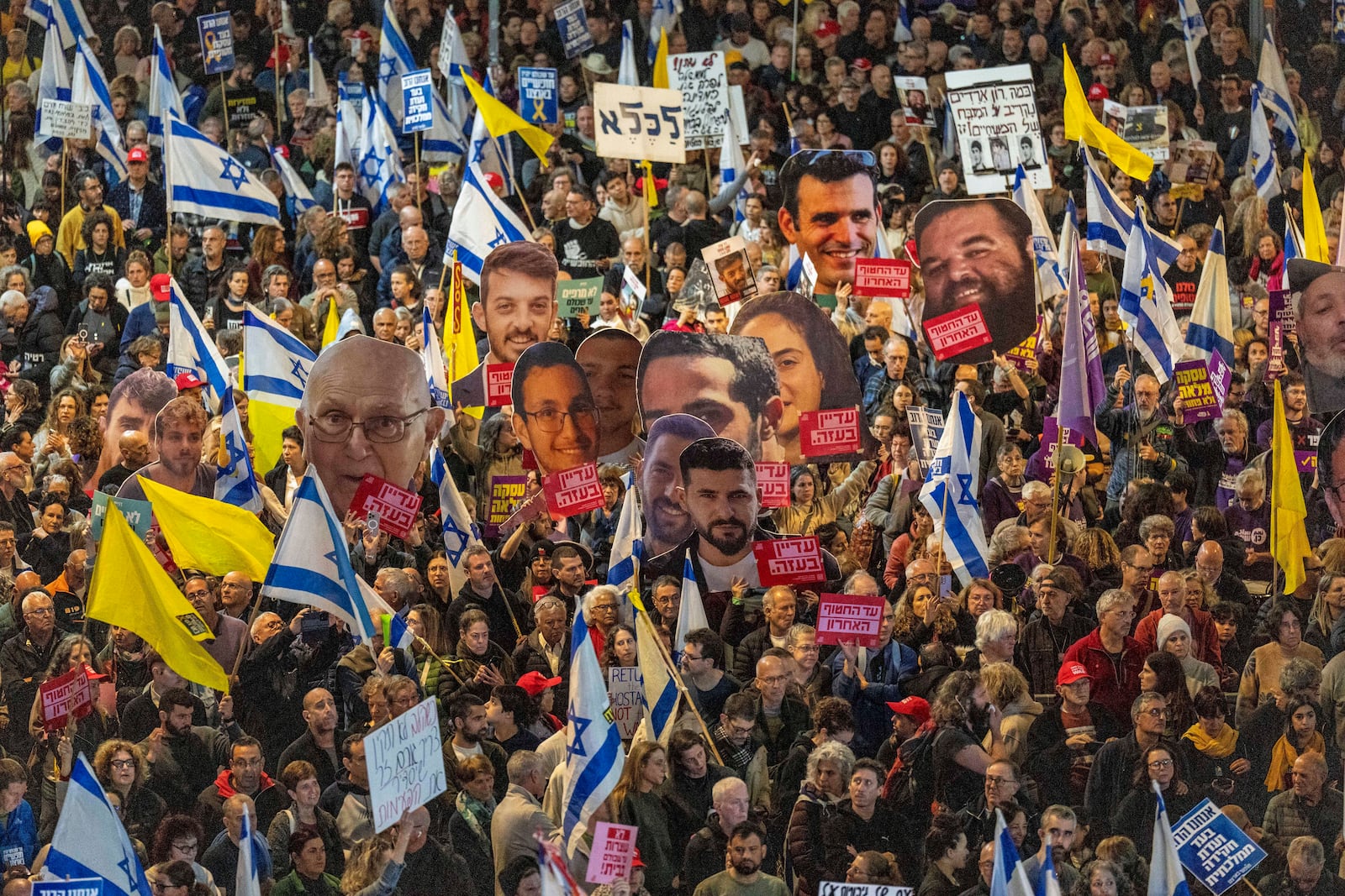 FILE - People take part in a protest in Tel Aviv, Israel, Saturday, March 8, 2025, demanding the immediate release of hostages held by Hamas in the Gaza Strip. (AP Photo/Ariel Schalit, File)