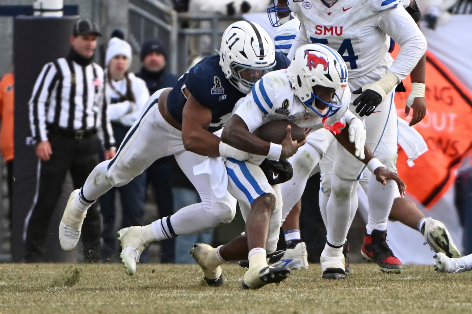 Penn State defensive end Abdul Carter sacks SMU quarterback Kevin Jennings during the second half in the first round of the NCAA College Football Playoff, Saturday, Dec. 21, 2024, in State College, Pa. (AP Photo/Barry Reeger)