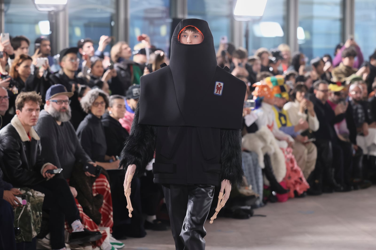 A model wears a creation as part of the men's Walter van Beirendonck Fall-Winter 2025-2026 collection, that was presented in Paris, Wednesday, Jan. 22, 2025. (AP Photo/Thomas Padilla).