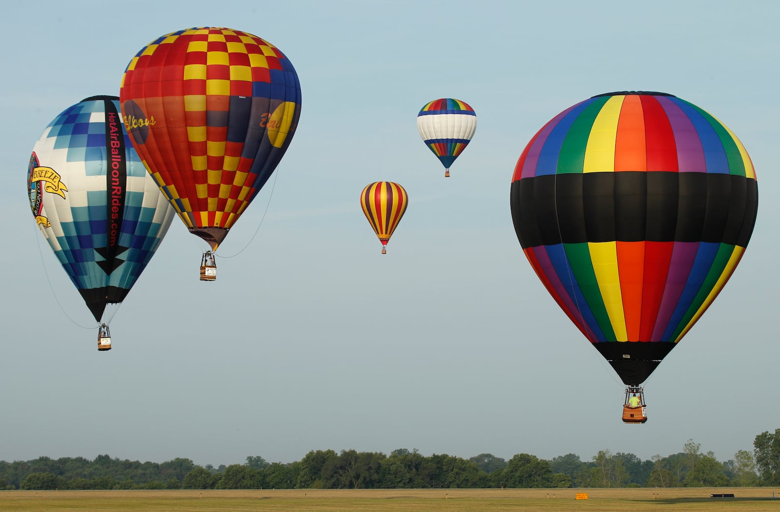 Eleven hot air balloons landed at Grimes Field in Urbana after a morning flight on Saturday, July 7, 2012, during the sixth annual Balloon Fest which is coordinated by the Champaign County Visitors Bureau. Staff photo by Barbara J. Perenic