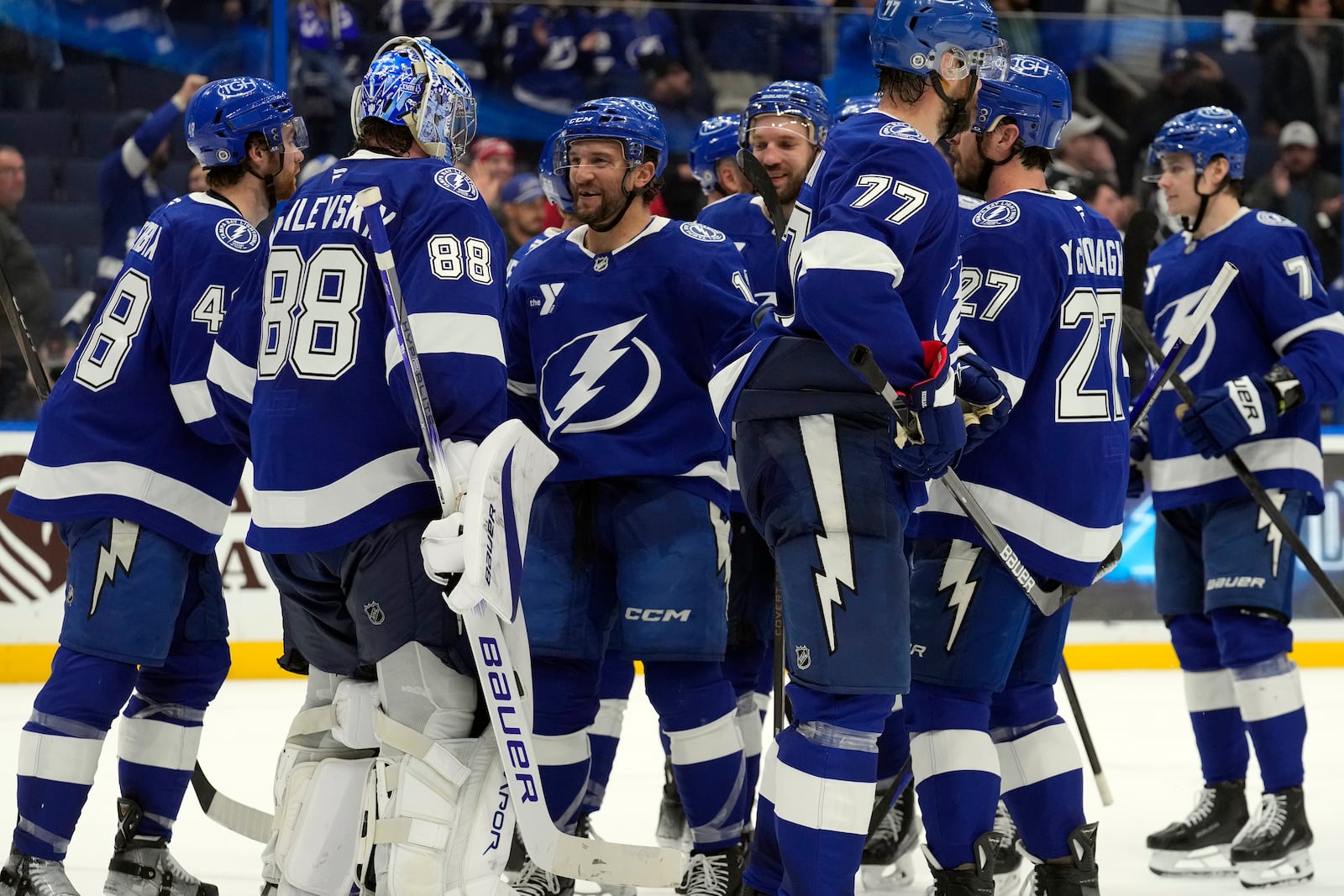 Tampa Bay Lightning goaltender Andrei Vasilevskiy (88) celebrates with teammates after the team defeated the Carolina Hurricanes in an NHL hockey game Tuesday, Jan. 7, 2025, in Tampa, Fla. (AP Photo/Chris O'Meara)