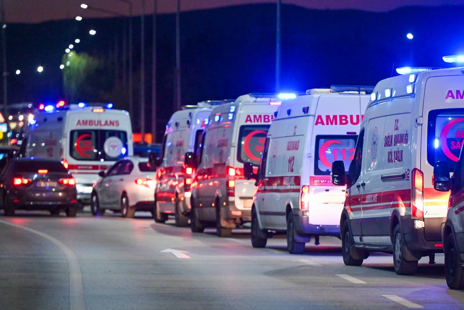 Ambulances wait in line outside of Turkish Aerospace Industries Inc. at the outskirts of Ankara, Turkey, Wednesday, Oct. 23, 2024. (AP Photo/Mert Gokhan Koc)