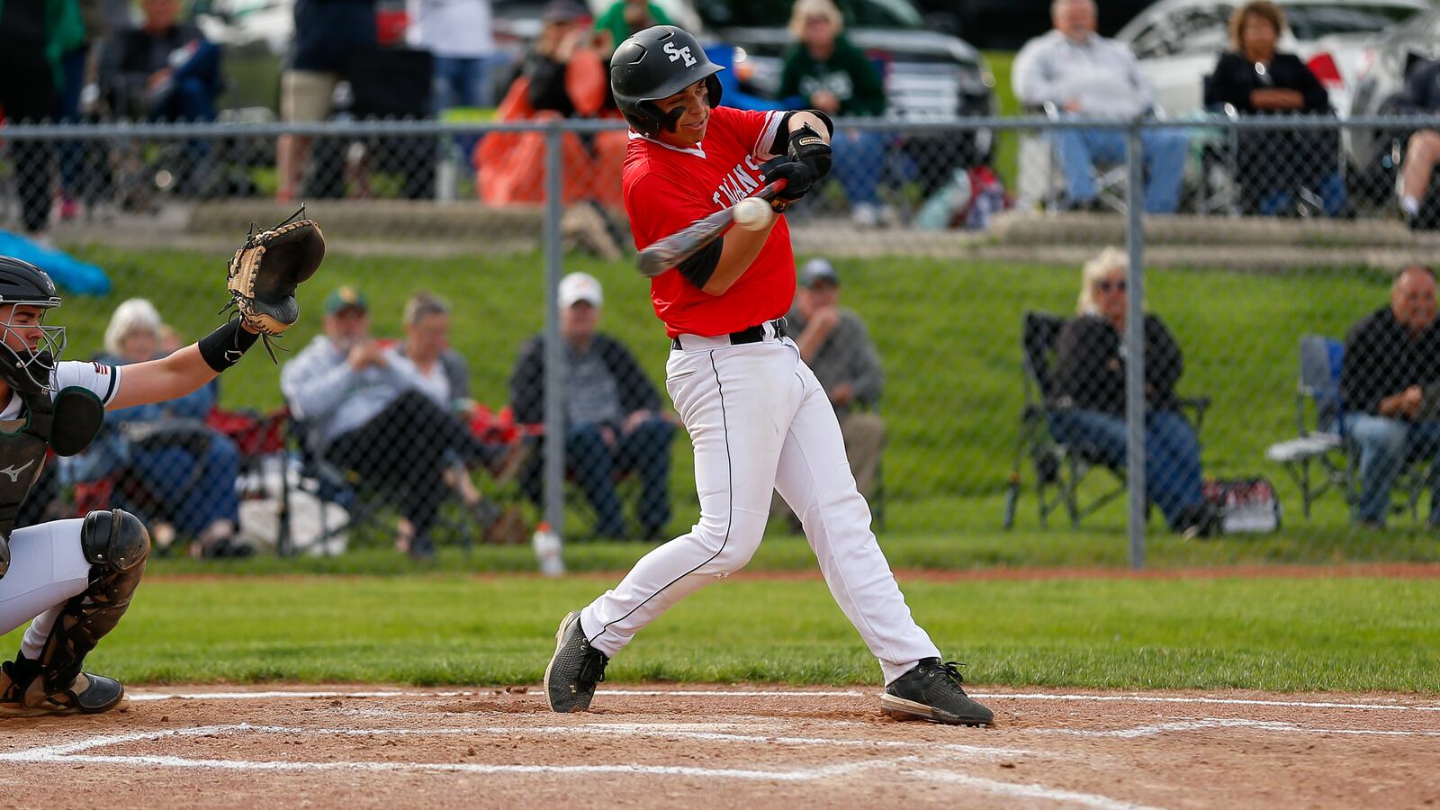 Southeastern High School junior Kason Spears swings during a Division IV district semifinal game on Monday, May 23, 2022 at Troy High School's Market Street Field. Photo by Michael Cooper