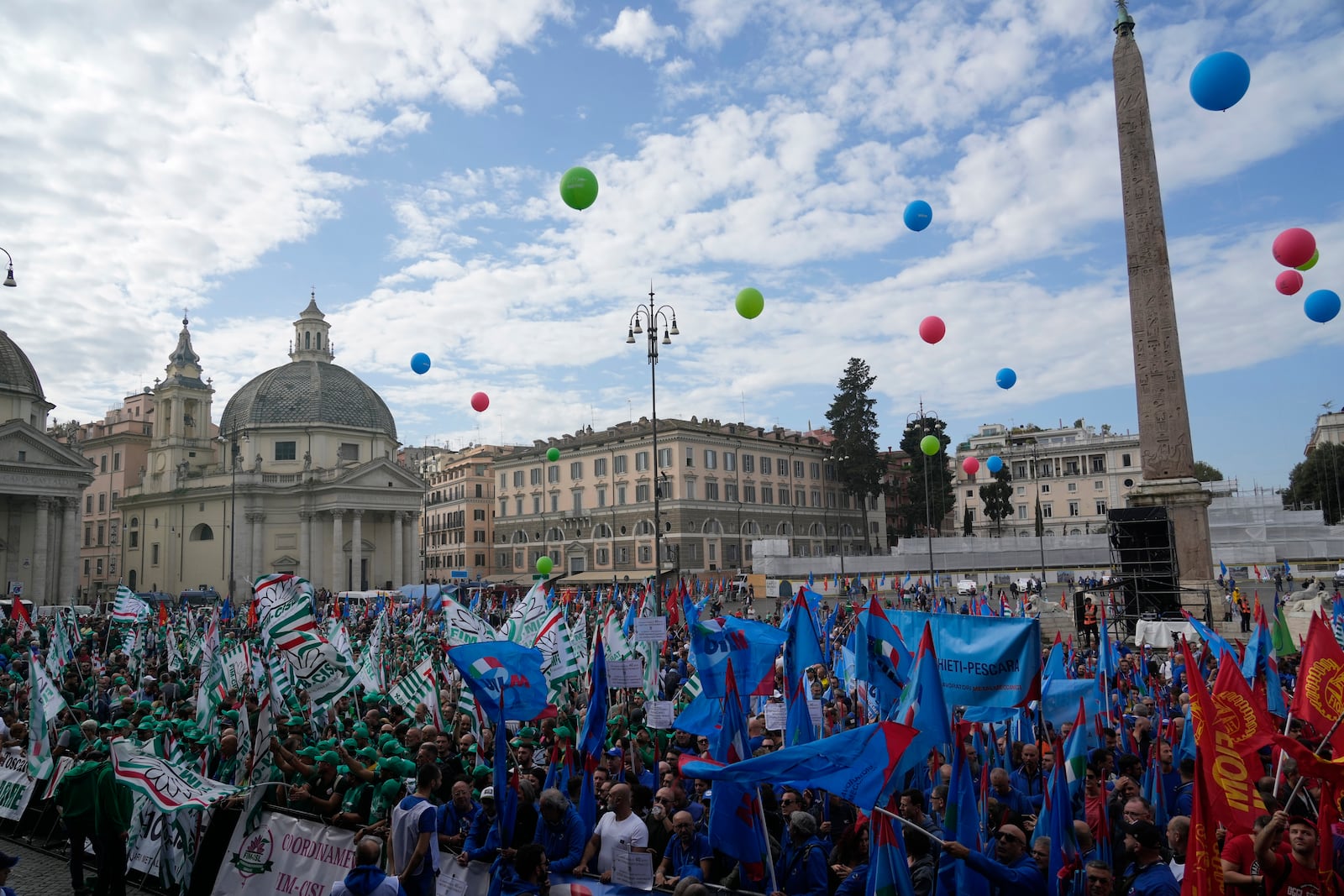 Workers of automotive sector gather in Rome's Piazza del Popolo Square during a demonstration on the occasion of their national strike, Friday, Oct. 18, 2024. (AP Photo/Gregorio Borgia)