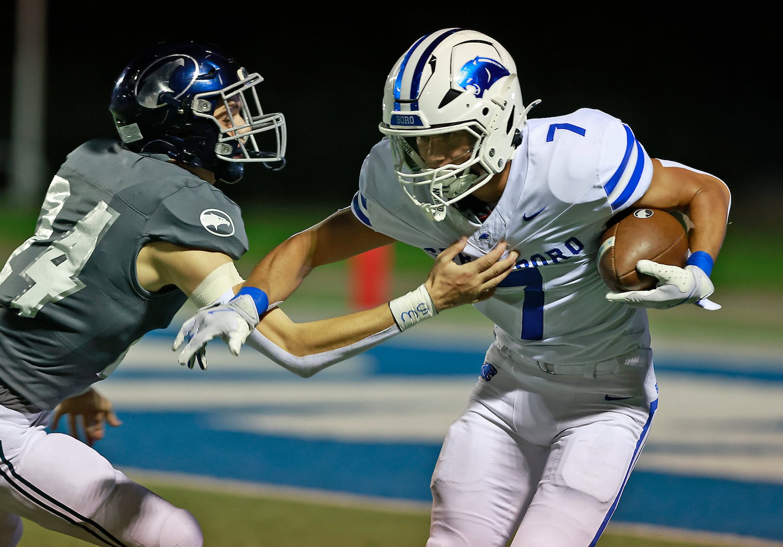 Springboro's Brayden Wilhite tries to avoid a tackle by Fairmont's Logan Wilkins. BILL LACKEY/STAFF