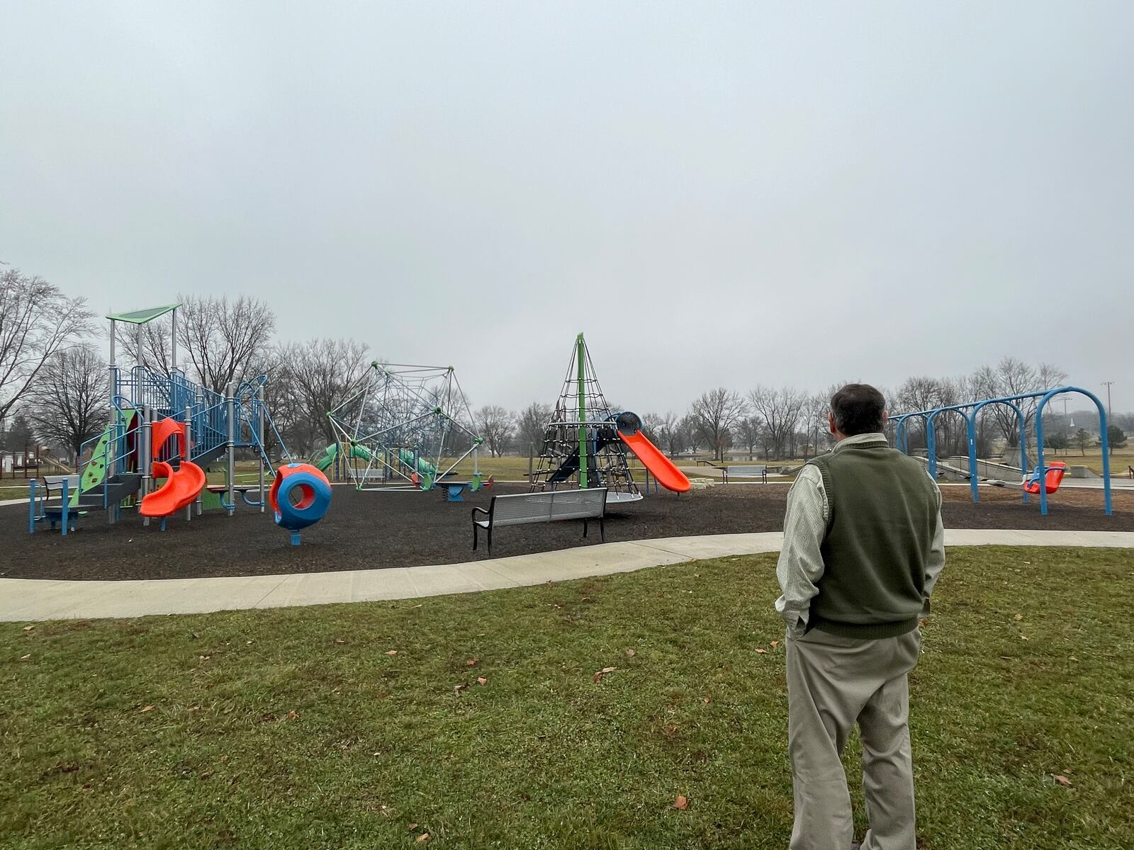 Urbana Mayor Bill Bean stands before and inclusive playground built at the city's park.