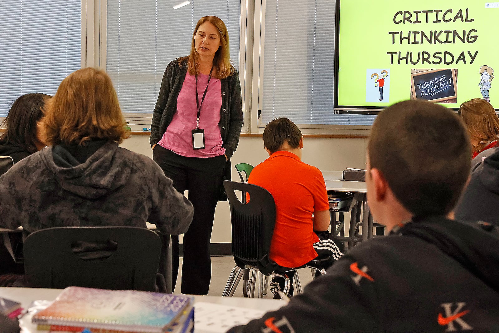 Clark-Shawnee Middle School teacher Joanne Gilley works with students on a critical thinking exercise. BILL LACKEY/STAFF