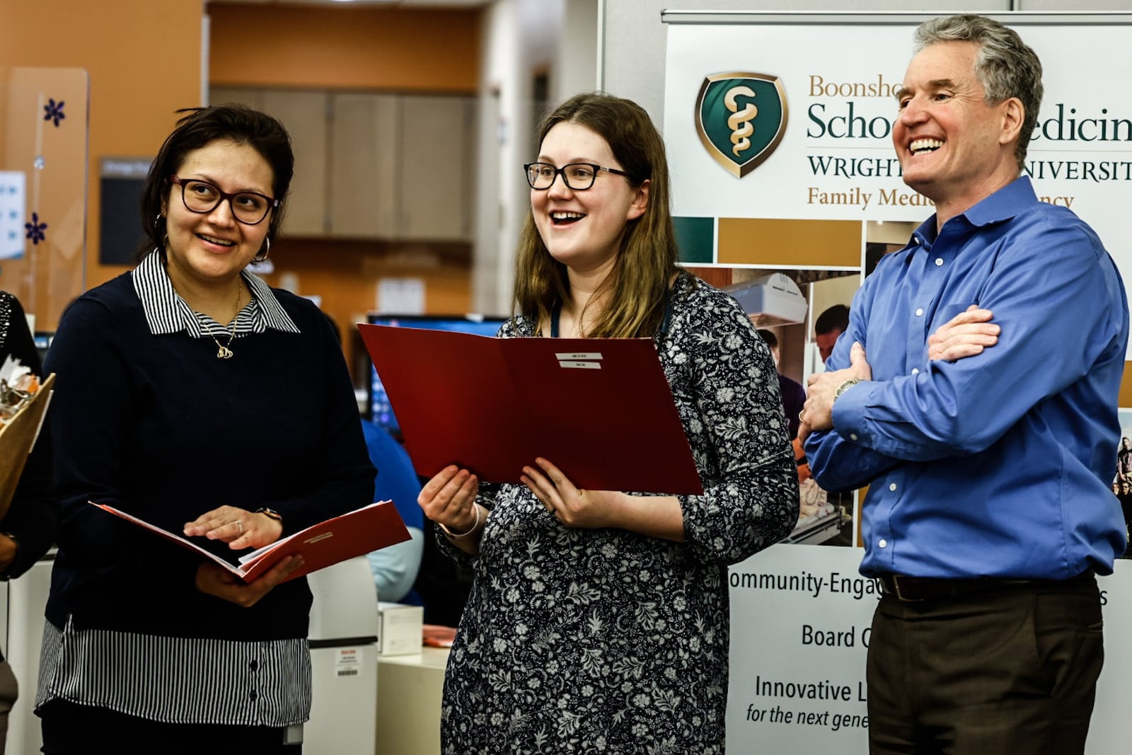 Medical residents, Dr. Alexandra Diaz, left and  Dr. Anna Moore along with Wright State professor Dr. Peter Reynolds at Five Rivers Family Health Center. Wright State's Boonshoft School of Medicine received a $2.3 million grant for mental health training for residents in their family medicine program. JIM NOELKER/STAFF